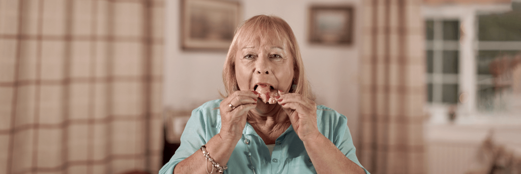 Lady called Maggie taking out her fake teeth caused by cancer