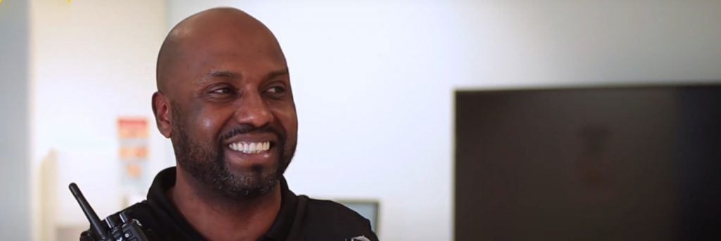 Black man wearing security guard uniform