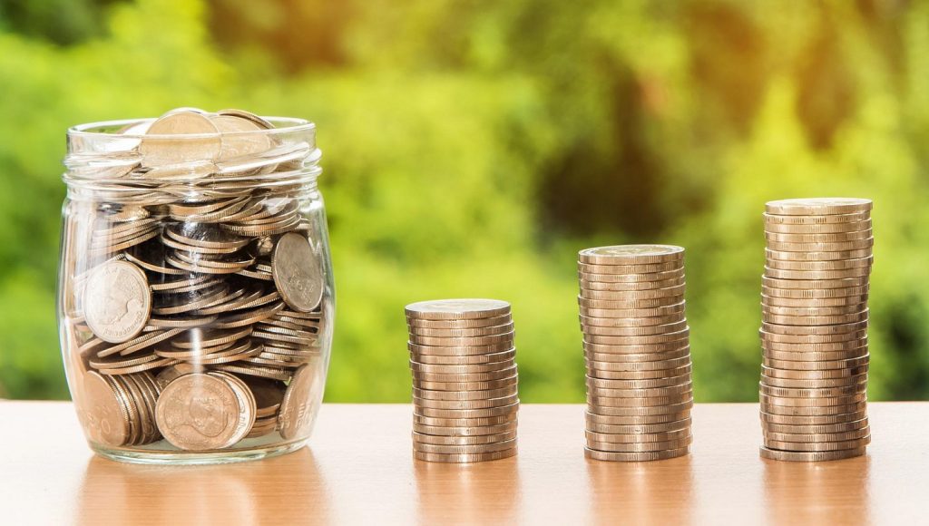 Glass jar full of coins