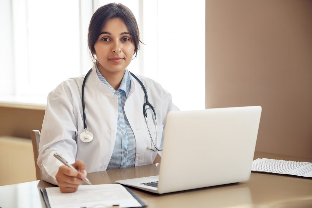 South east Asian female doctor offering stop smoking support